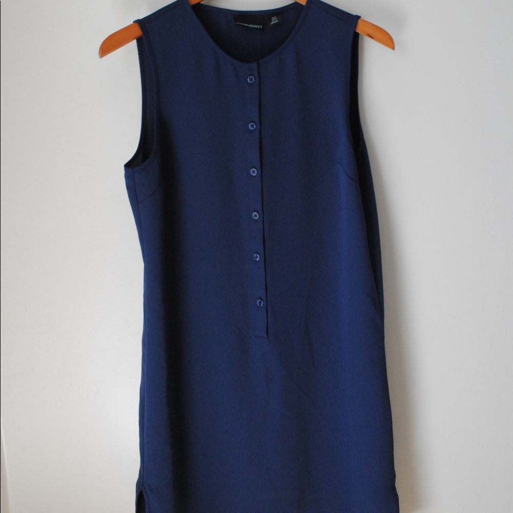 Classic navy blue dress with button detail.